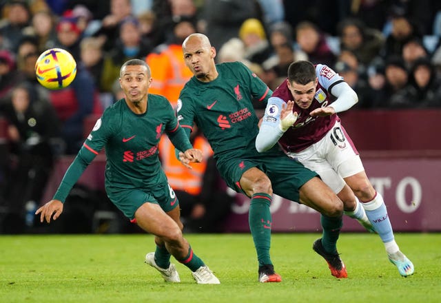 Liverpool midfielder Fabinho battles with Aston Villa’s Emiliano Buendia 