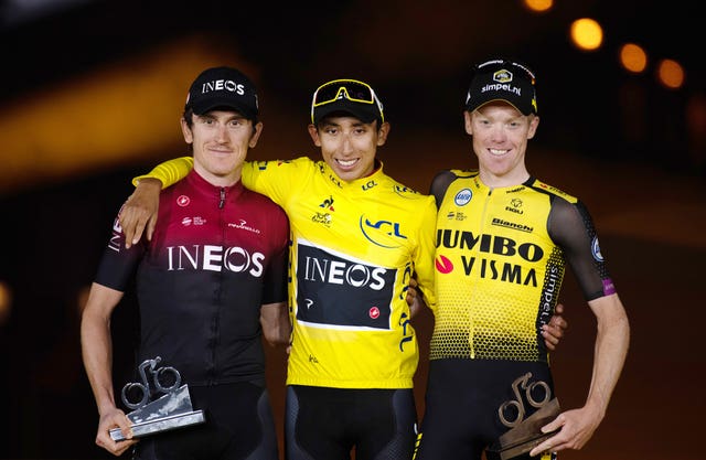 Egan Bernal (centre) celebrates his Tour de France win last year alongside Geraint Thomas (left) and Team Jumbo Visma’s Steven Kruijswijk 