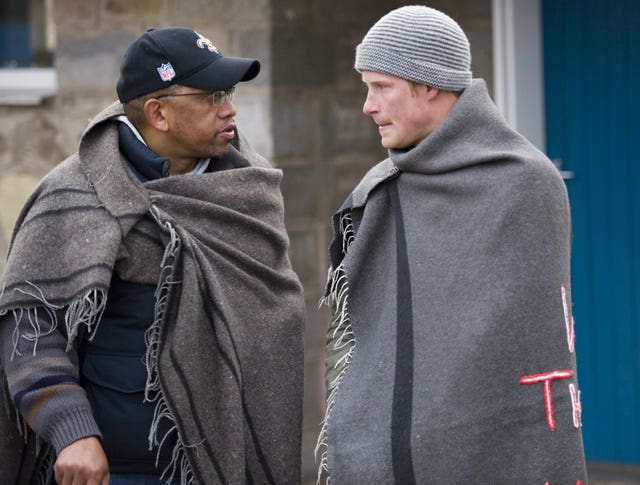 Harry, right, with Lesotho’s Prince Seeiso, both wrapped in blankets