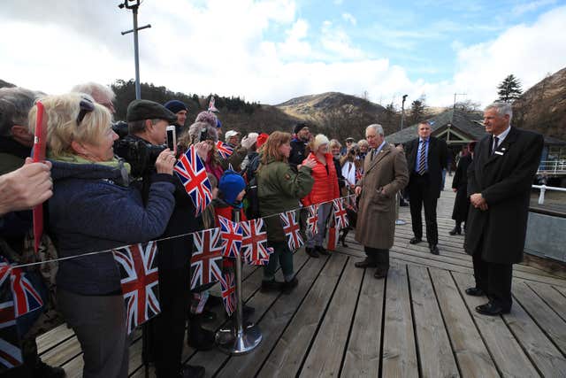 The Prince of Wales arrives to view the Lady of the Lake, flagship vessel of the Ullswater Steamers company in Glenridding (Peter Byrne/PA) 