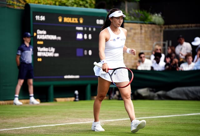 Lily Miyazaki walks to the net looking dejected