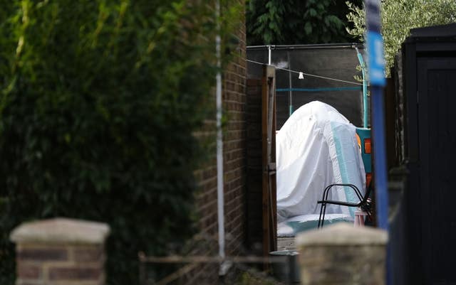 A view into the back garden of the property in Bremer Road, Staines-Upon-Thames where three children and a man were found dead 