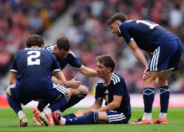 Scotland’s Billy Gilmour sits injured during a friendly against Curacao