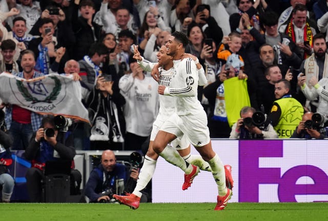 Kylian Mbappe (left) celebrates with Jude Bellingham