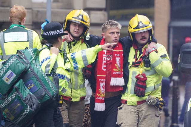 Fan Jack Trotter being helped by first responders after the incident in Liverpool