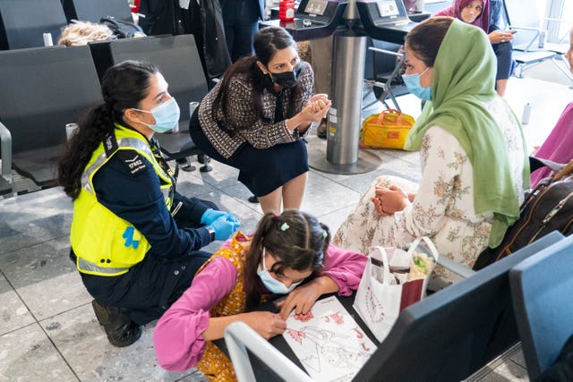 Priti Patel with Afghan refugees