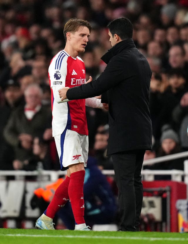 Mikel Arteta greets Martin Odegaard