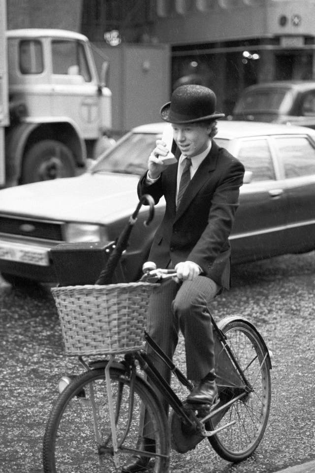 Nicholas Pearce, managing director of Cellular One, speaking directly to the US whilst cycling through London traffic with the first truly portable telephone (PA)