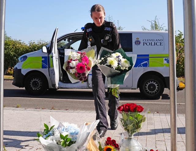 Police officer with flowers 