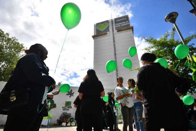 People release balloons at the Grenfell Memorial Community Mosaic (Victoria Jones/PA)