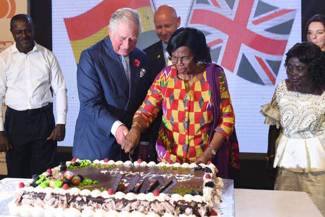 Charles cuts a birthday cake made for him and other guests, during a reception at the British High Commissioner’s residence in Accra, Ghana, during his recent tour of West Africa. Joe Giddens/PA Wire