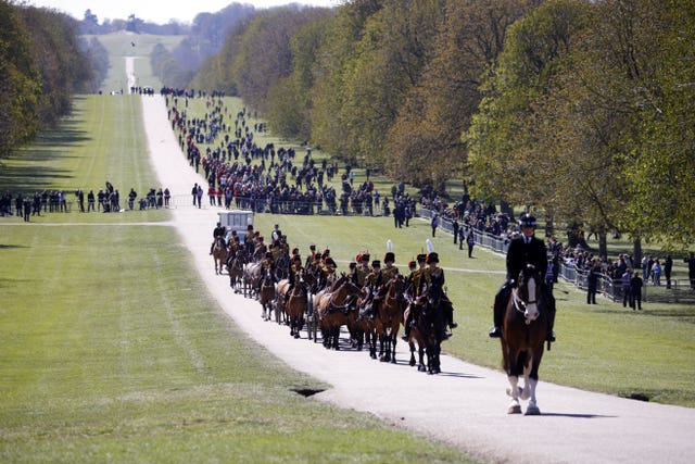 The Kings Troop Royal Horse Artillery make their way up The Long Walk