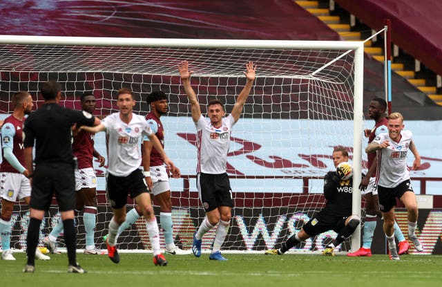 Sheffield United players appeal for a goal against Aston Villa, but GLT failed to detect the ball had crossed the line 