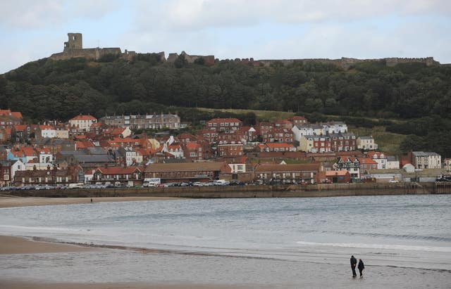 People on South Bay beach at Scarborough (Anna Gowthorpe/PA)
