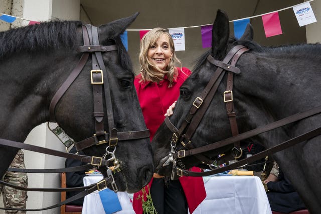 Presenter Mel Giedroyc feeds horses with carrots (Aaron Chown/PA)