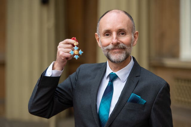 Glenn Brown with his CBE