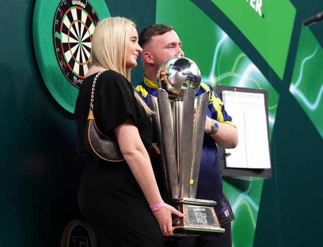 Luke Littler celebrates with girlfriend Faith Millar
