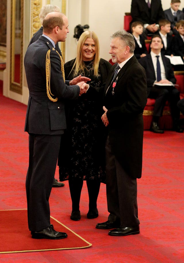 It was back to work for William following the royal summit - presenting an MBE to Alexander Duguid for services to deaf people and to British sign language education. Jonathan Brady/PA Wire