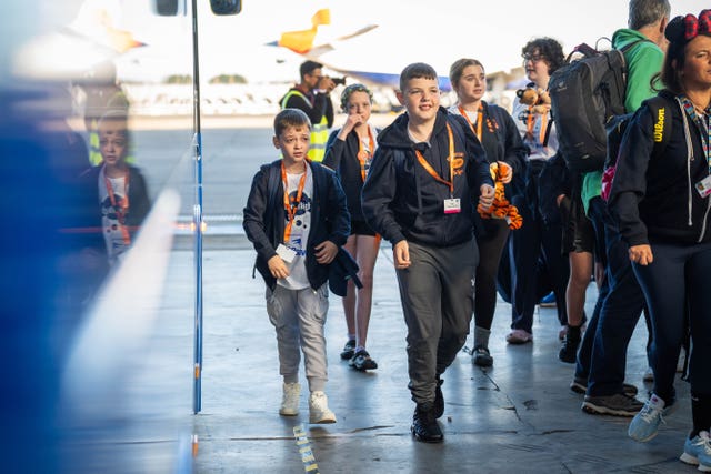 Freddy Gardiner, 12, from Gateshead (left) arrives for his flight