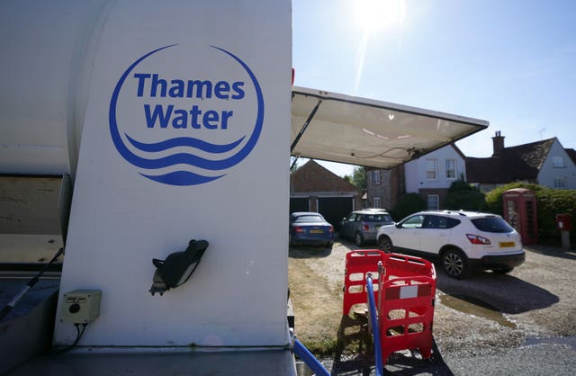 A tanker from Thames Water pumps water into another tanker in the village of Northend in Oxfordshire