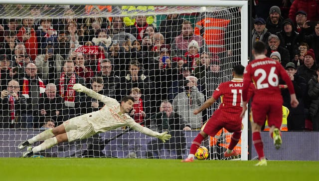 Mohamed Salah strikes a penalty with his left foot low into the bottom corner