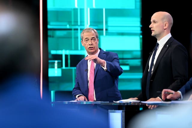 Nigel Farage gestures as he takes part in a TV debate