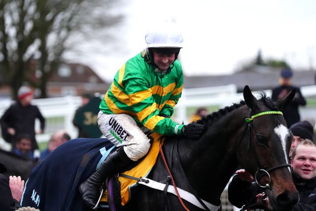 Nico de Boinville celebrates after winning the Tingle Creek with Jonbon