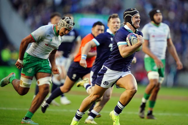 Darcy Graham smiles as he breaks free to score Scotland’s fourth try against Portugal