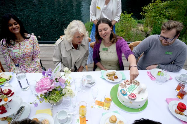 Queen Camilla, Patron of The Big Lunch, sat with SEN teacher Melanie Booth (right) from Westbury in Wiltshire, the winner of The Big Lunch Recipe Search, Wharf