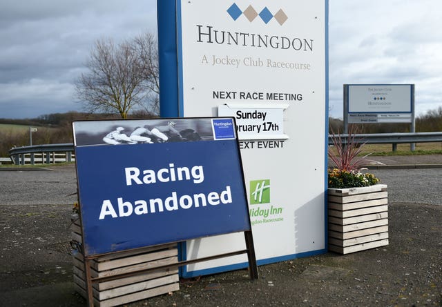 A sign at Huntingdon Racecourse after racing was abandoned because of the equine flu outbreak