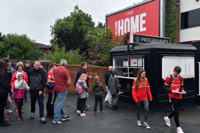 Fans purchase programmes at Old Trafford ahead of Manchester United's friendly against Everton (Anthony Devlin/PA).