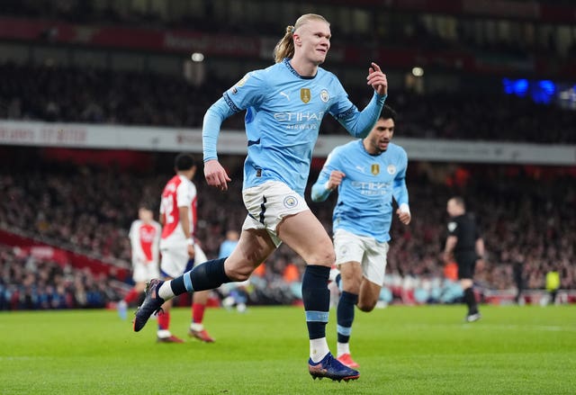Erling Haaland runs to celebrate his goal