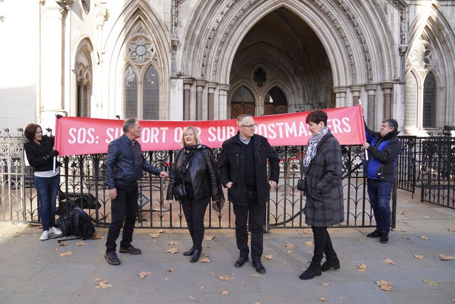 Former subpostmasters outside the the Royal Courts of Justice, London 