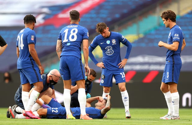 Christian Pulisic lies on the pitch injured during the FA Cup final 