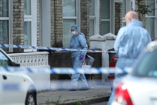 Forensic officers at the scene in Corrance Road