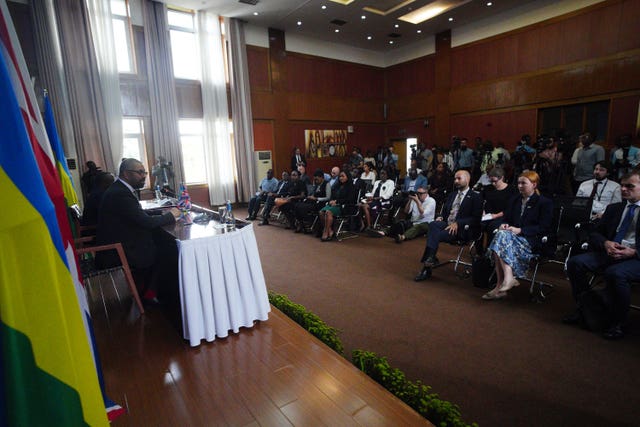 Home Secretary James Cleverly speaks during a press conference in Kigali 
