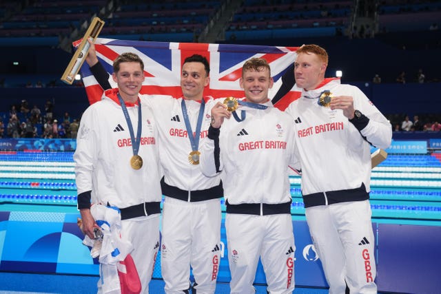 (l to r) Duncan Scott, James Guy, Matthew Richards and Tom Dean pose with their gold medals after winning the men’s 4 x 200m freestyle relay final 