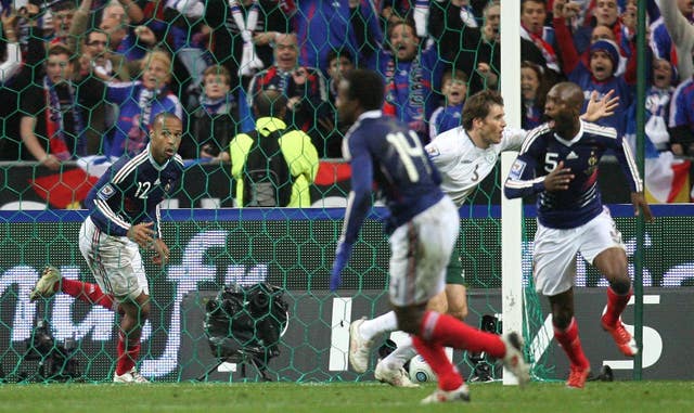 Thierry Henry, left, celebrates after setting up William Gallas