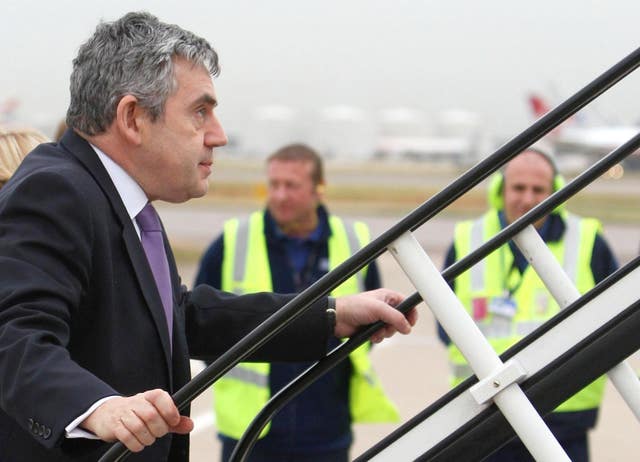 Then prime minister Gordon Brown boards at plane at Heathrow in November 2008 (Steve Parsons/PA)