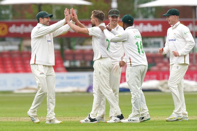 Leicestershire’s Wiaan Mulder (centre) celebrates the wicket of Steve Smith