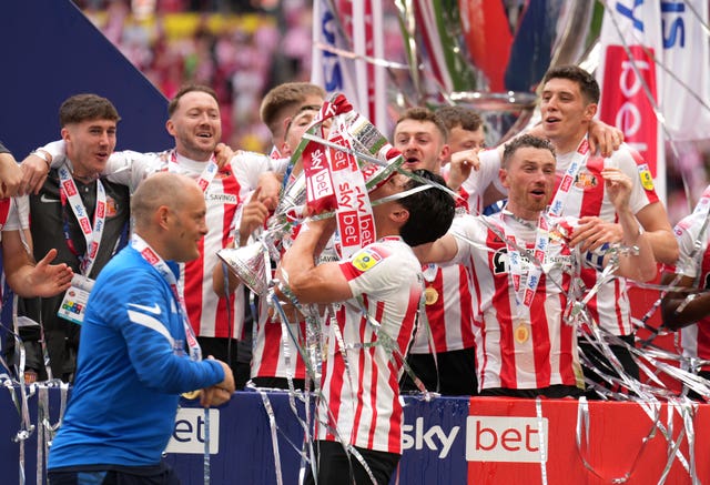 Sunderland’s Luke O’Nien celebrates with the trophy after the League One play-off final victory over Wycombe