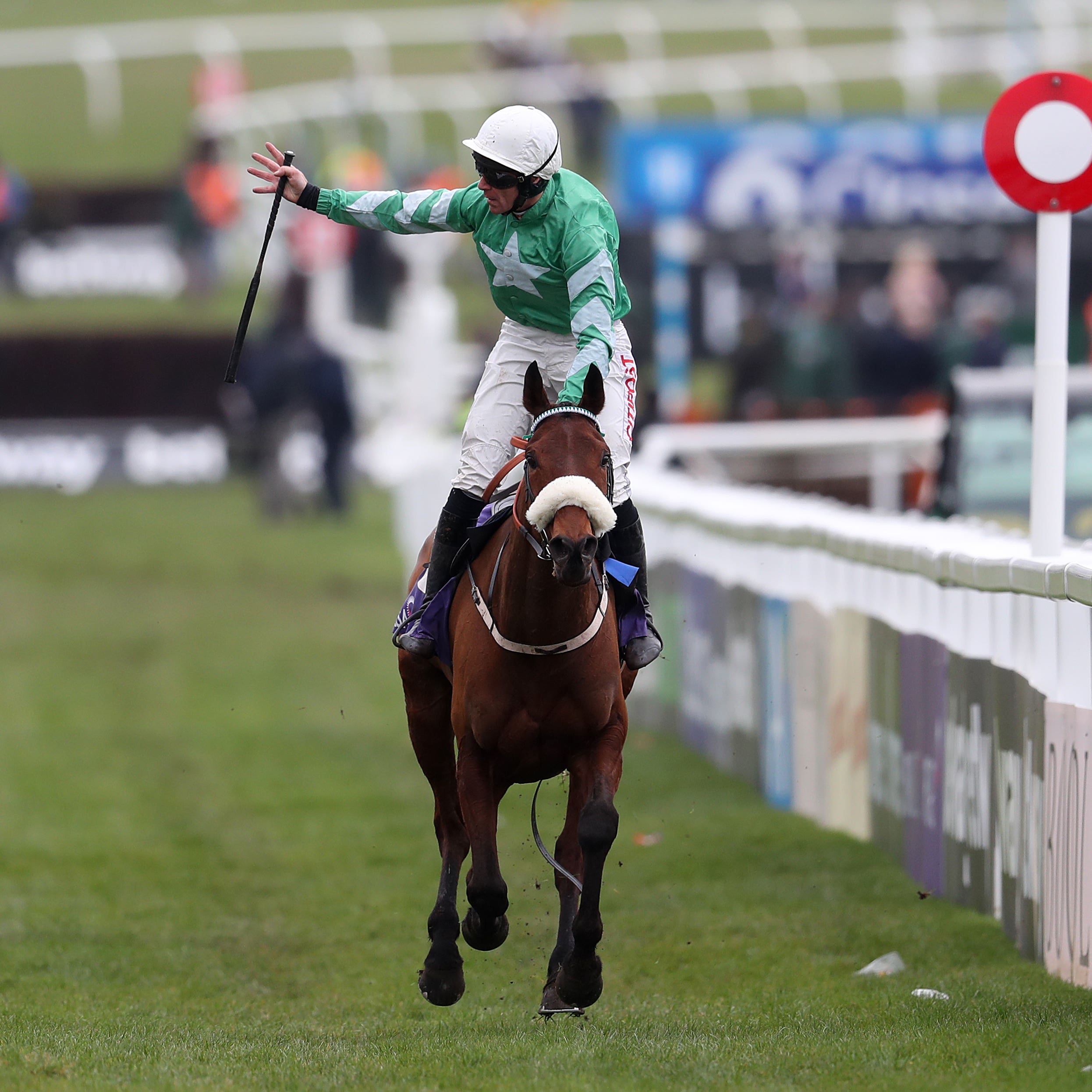 Davy Russell celebrates on Presenting Percy after winning the RSA Chase