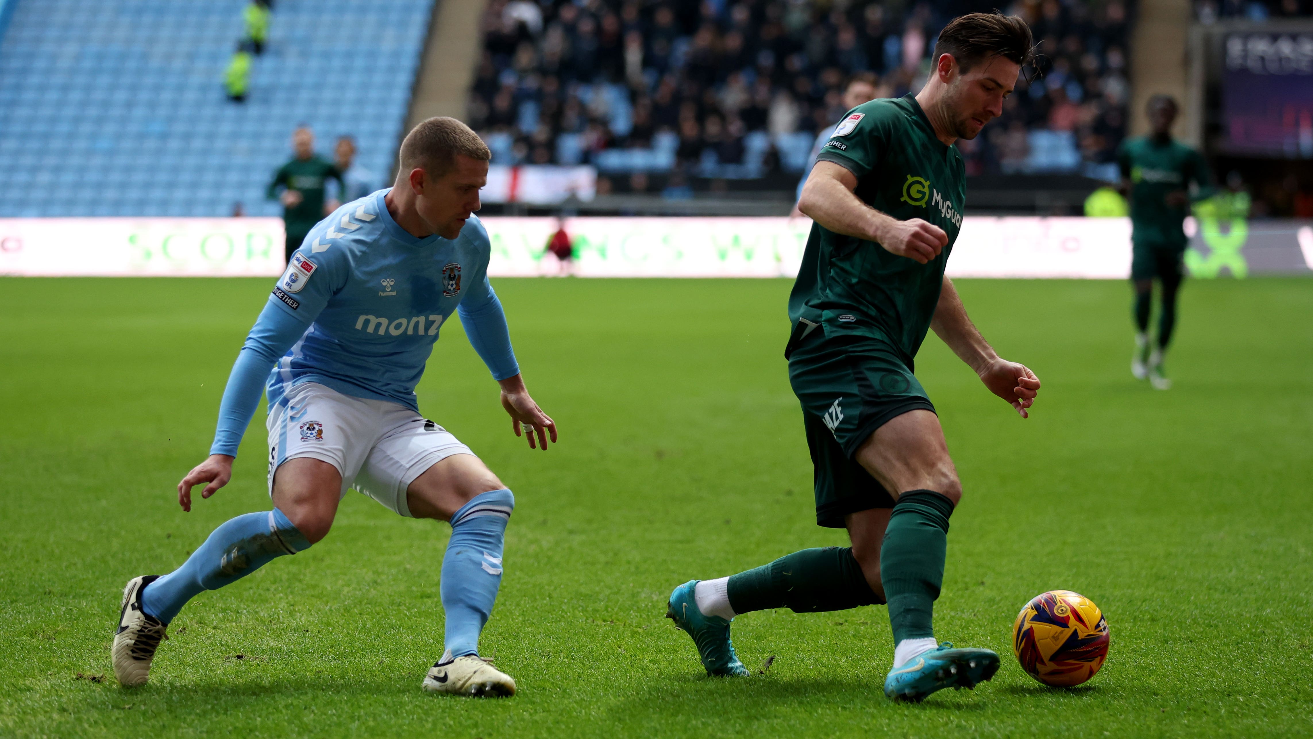 Coventry’s Jake Bidwell (left) and Millwall’s Ryan Leonard (right) battle for the ball (Chris Radburn/PA)