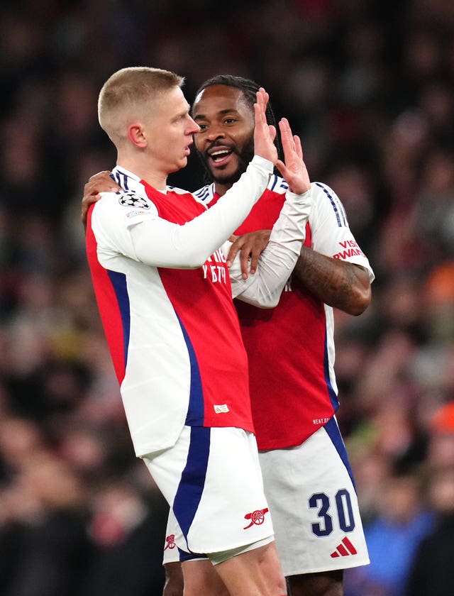 Arsenal’s Oleksandr Zinchenko (left) celebrates scoring their side’s first goal of the game with team-mate Raheem Sterling during the UEFA Champions League round of sixteen second leg match at Emirates Stadium, 