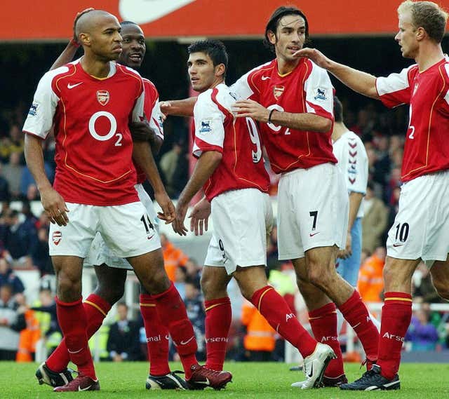 Thierry Henry celebrates scoring against Aston Villa to take Arsenal 49 games unbeaten