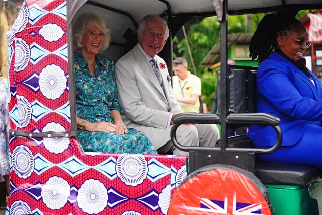 The King and Queen in a tuk-tuk at Fort Jesus, in Mombasa Old Town