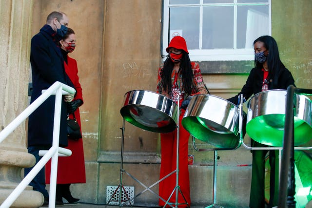 The Duke and Duchess of Cambridge listen to members of the Reading All Steel Percussion Orchestra, during a visit to the Royal Berkshire Hospital in Reading, Berkshire, to meet NHS staff and pass on their thanks on behalf of the nation for their tireless efforts during the pandemic, on the final day of a three-day tour across the country 