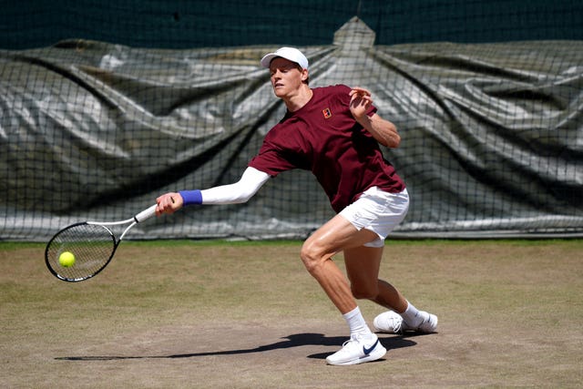 Jannik Sinner hits a forehand on the practice court
