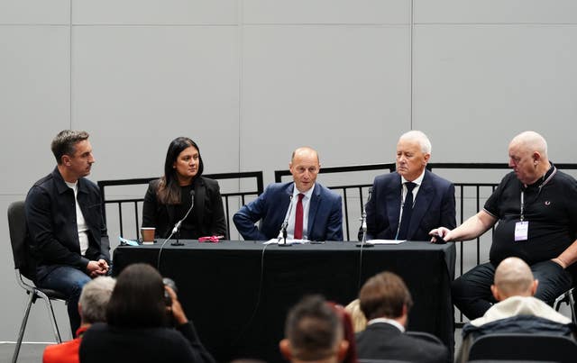 Gary Neville and Culture Secretary Lisa Nandy sat at a table with others during the Labour Party Conference in ACC Liverpool 