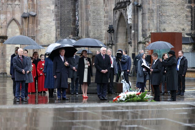 Left to right, Hamburg’s mayor Peter Tschentscher, the King, Elke Buedenbender, and German President Frank-Walter Steinmeier during a wreath-laying ceremony, symbolising reconciliation and the German-British friendship, at St Nikolai Memorial Church, Hamburg
